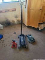 Overall view of both floor jacks and one jack stand