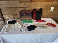 Overall lot showing all eight bags on table
