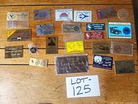Overview of all dash plaques and pin on wooden surface