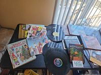Overview of records and booklets on table