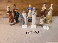 Group shot of all eight figurines on table