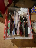Top view of plastic tote filled with assorted greeting cards