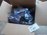 Cardboard box containing multiple zip-bagged sock bundles