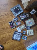 Overview of all frames scattered on floor showing variety of sizes and finishes