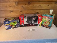 All three boxed items on table: Shadow Runner, Jeep Monster Rubicon, Mother Bear