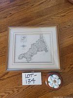 Framed map print and wooden plaque together