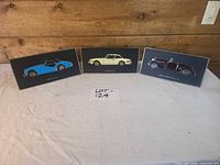 All three Triumph car plaques displayed upright