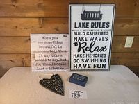 Group shot of all four wooden signs on table