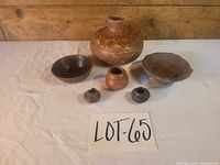 Group shot of all six terracotta vessels