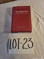 Front view of signed hardcover book with dust jacket