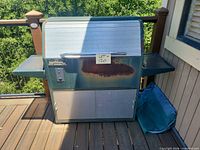 Front view of Traeger pellet smoker grill on deck