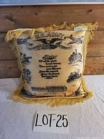 Front view of yellow satin pillow with U.S. Army Camp Croft graphics