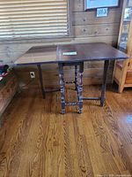 Table with one leaf extended showing overall construction and finish