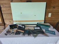 Overall lot showing drafting board, instruments spread out