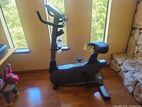Side profile of Vision Fitness E3000 upright exercise bike showing overall condition, seat, pedals and frame