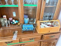 Overview of lot on hutch showing candles, glassware and wooden tote