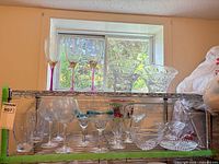 Overall view of shelves with assorted glassware