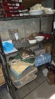 Full view of chrome wire shelving unit loaded with items