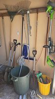 Overview of long-handle tools, trash can, mop, buckets, cordless trimmer