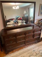 Front view of dresser with attached mirror showing overall design