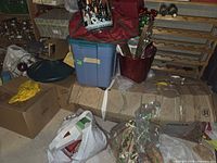 Overall view of lot including boxed tree, storage tote, containers and bags
