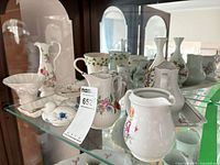 Shelf view showing multiple Kahla porcelain pieces