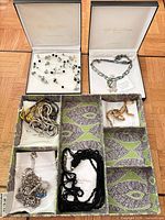 Overview of lot showing two boxed necklaces and compartmental tray with assorted chains
