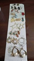Full view of all earrings arranged on board