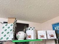 Portmeirion vase on shelf with boxed vase and Bowring boxed bowls
