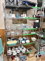 Full view of 5-shelf stainless wire rack loaded with items