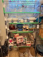 Full view of five-shelf metal rack with contents