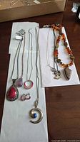 Group view of all seven jewellery pieces laid out