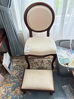 Full view of chair and matching footstool