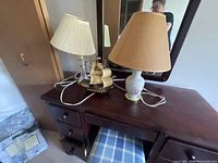 Overview of both lamps and ship model on dresser
