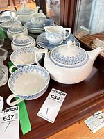 Overall view of teapot, cups, saucers, creamer and sugar bowl