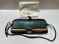 Folded clutch with dust bag
