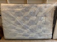 Front view of Beautyrest Renewal double mattress in plastic