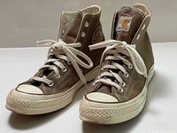 Front and side view of both sneakers showing overall condition, color, laces, toe caps
