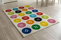 Full view of rug laid flat showing button design and size