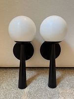 Both wall sconces front view showing design and finish