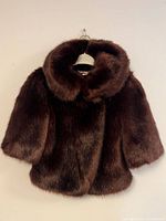 Front view of chestnut brown faux fur short jacket