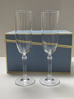 Full view of both Tiffany crystal flutes with presentation box