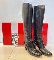 side profile of boots with designer box