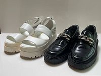 Both pairs of shoes side by side displaying overall style, colour and height comparison