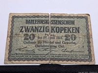 Front of 1916 20 Kopeken banknote showing denomination, date, issuing authority, wear and tear