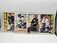 Front view of four Topps Premier Tools of the Game hockey cards