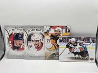 Front view of four Upper Deck hockey cards