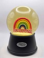 Front view showing rainbow, Love Is Love text, 2022 plaque on base