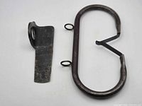 Oval loop piece and flat bracket side by side