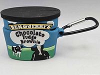 Front view of Ben & Jerry's Chocolate Fudge Brownie themed silicone AirPods case with carabiner